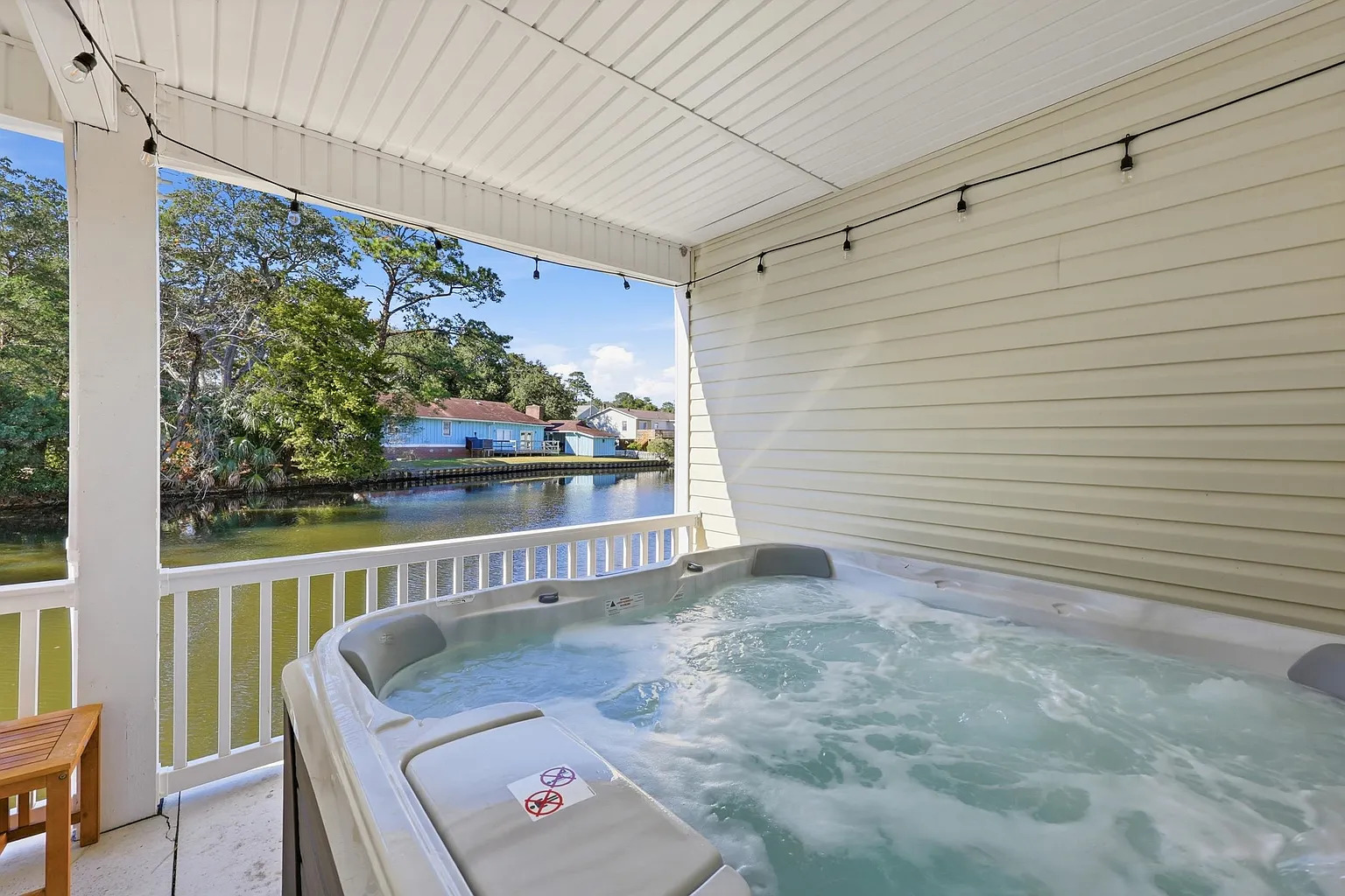 Hot tub with channel views at Banana Villa